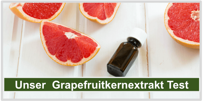 Grapefruitscheiben und eine Flasche mit Grapefruitkern Extrakt Grapefruitkernextrakt Test Bild